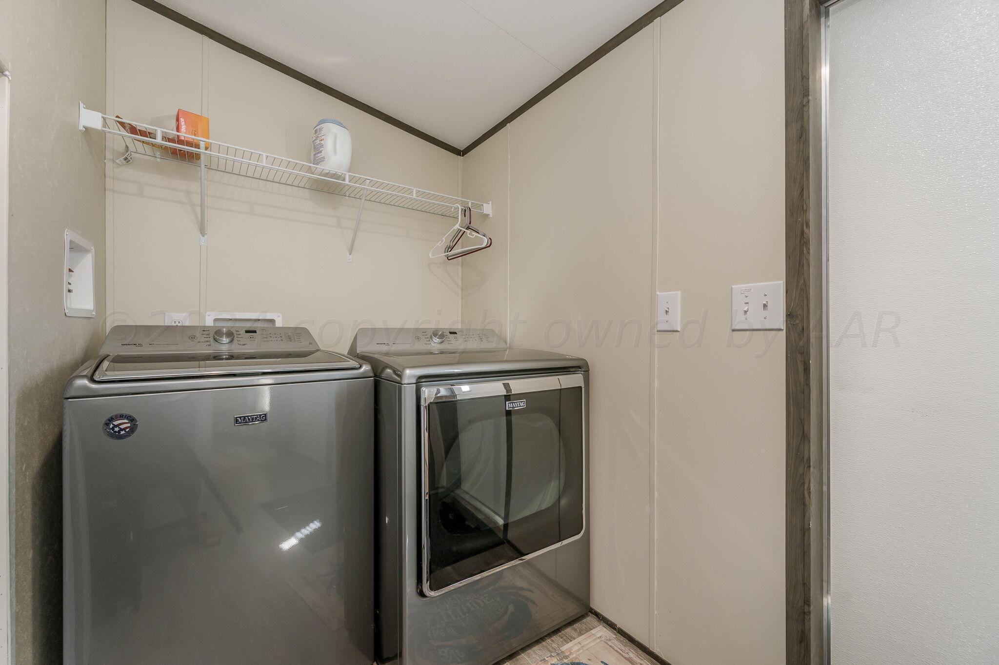11901 Ls Trail Amarillo, TX 79118 - Photo 11 of 14 a utility room with dryer and washer