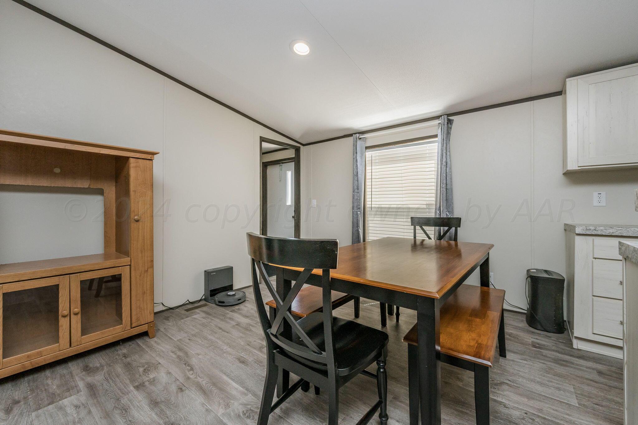 11901 Ls Trail Amarillo, TX 79118 - Photo 5 of 14 a view of a dining room with furniture and wooden floor