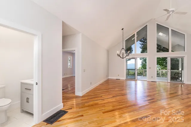 a view of an entryway of a house wooden floor and windows