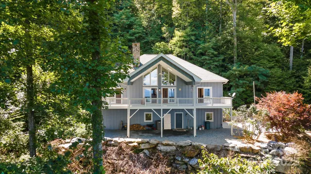a view of a house with roof and sitting area