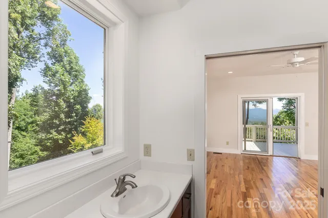 a white toilet sitting next to a bathroom sink