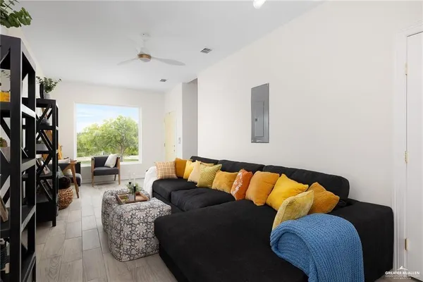 a living room with furniture and a window