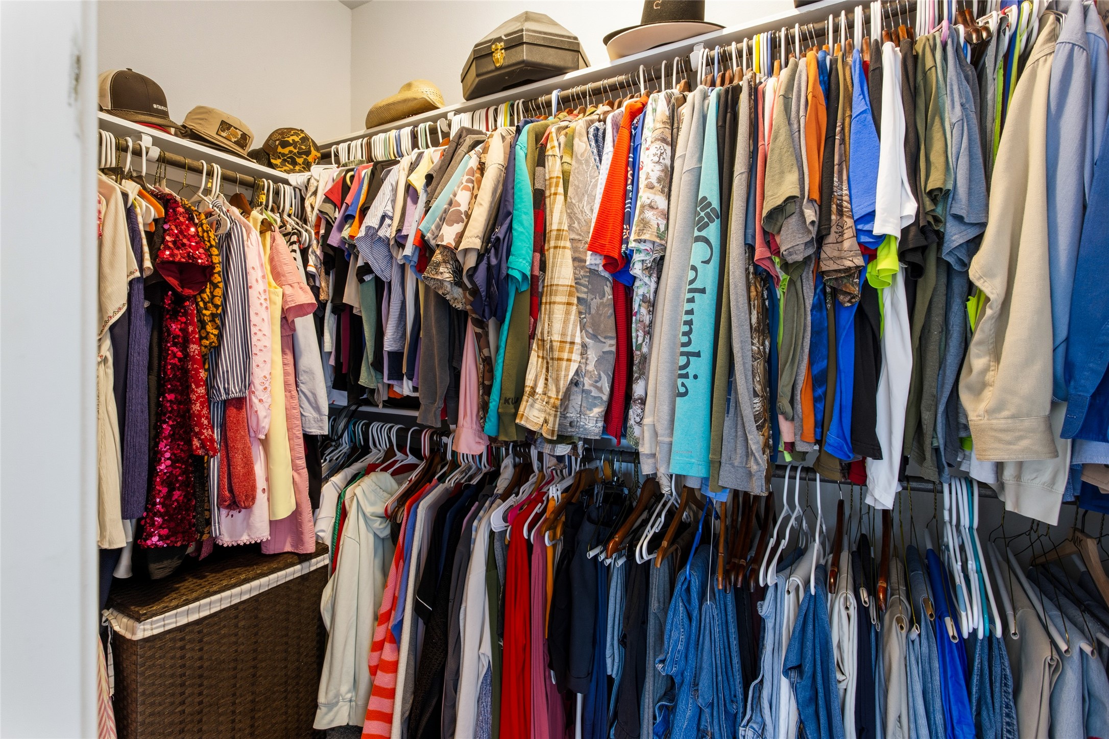 7254 Victorville Drive Rosharon, TX 77583 - Photo 12 of 27 a view of walk in closet with clothes