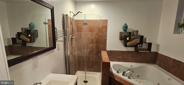 a bathroom with a bathtub and a sink