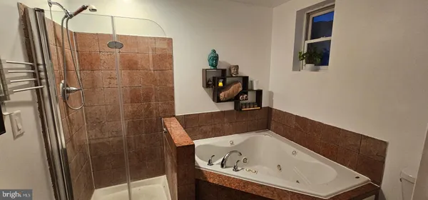 a bathroom with a tub and sink