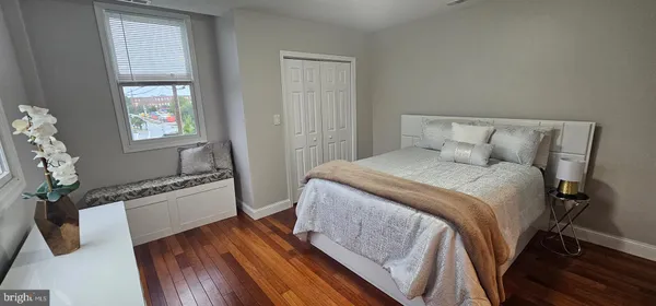 a bedroom with a bed and a window