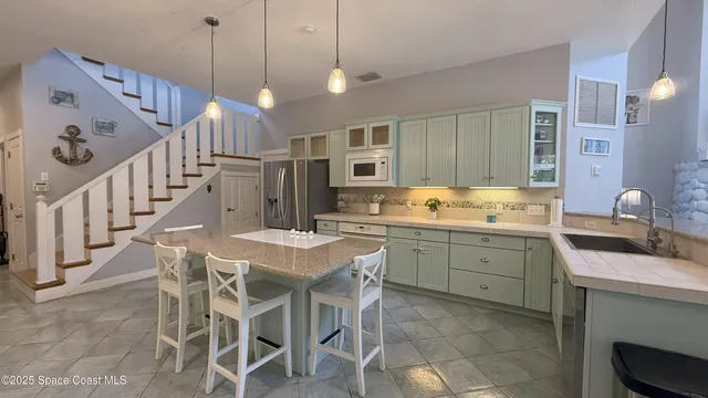 a living room with furniture a rug and a bookshelf