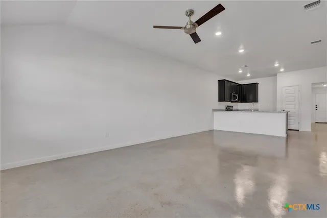 a view of a livingroom with kitchen