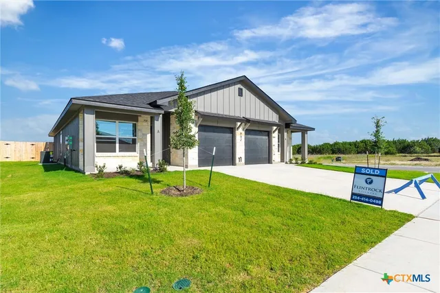 a view of an house with backyard porch and furniture