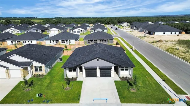 an aerial view of house with yard