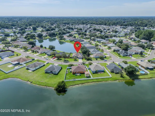 an aerial view of a golf course with parking space