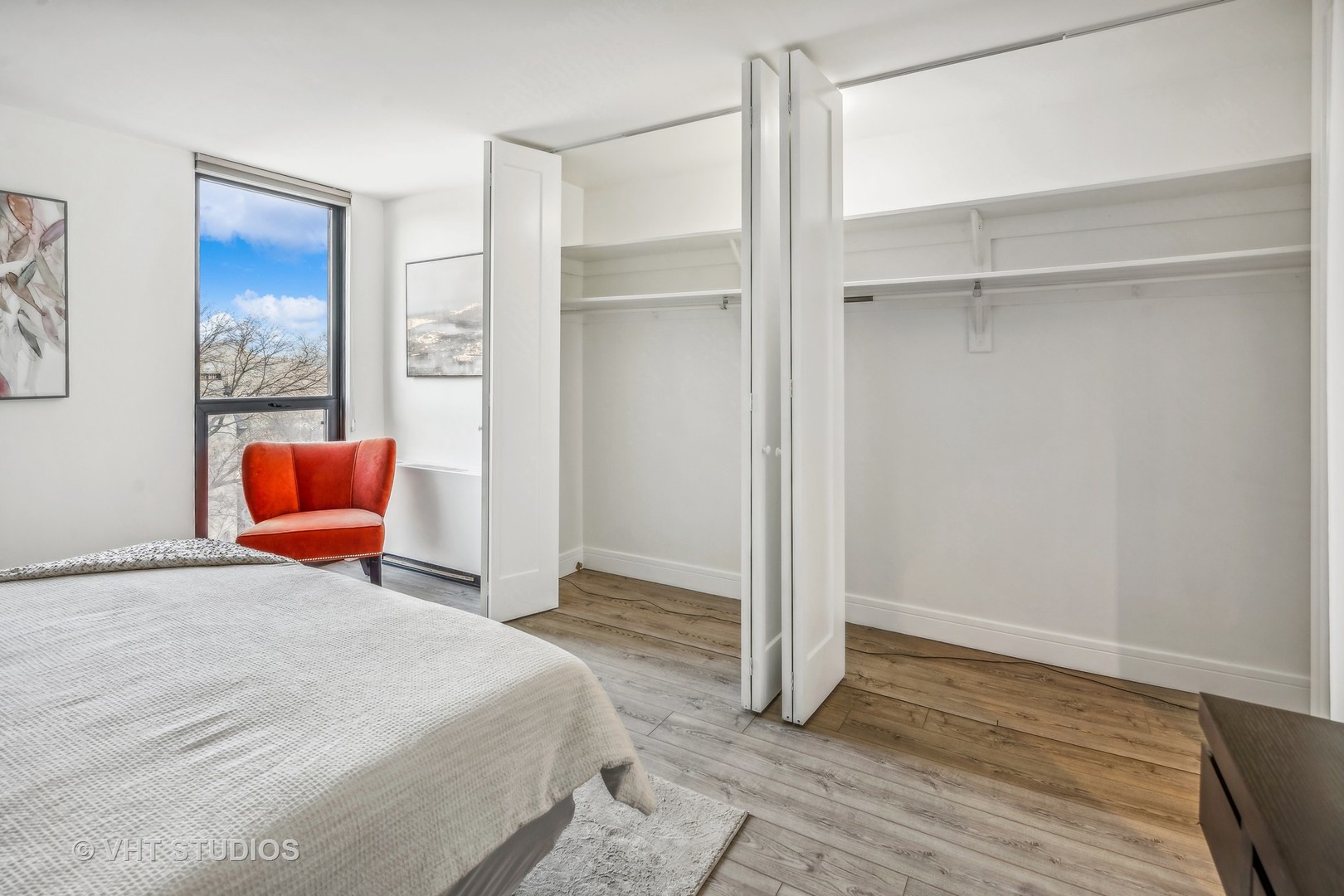 1850 North Clark Street, Unit 503 Chicago, IL 60614 - Photo 11 of 24 a bedroom with a bed and chair