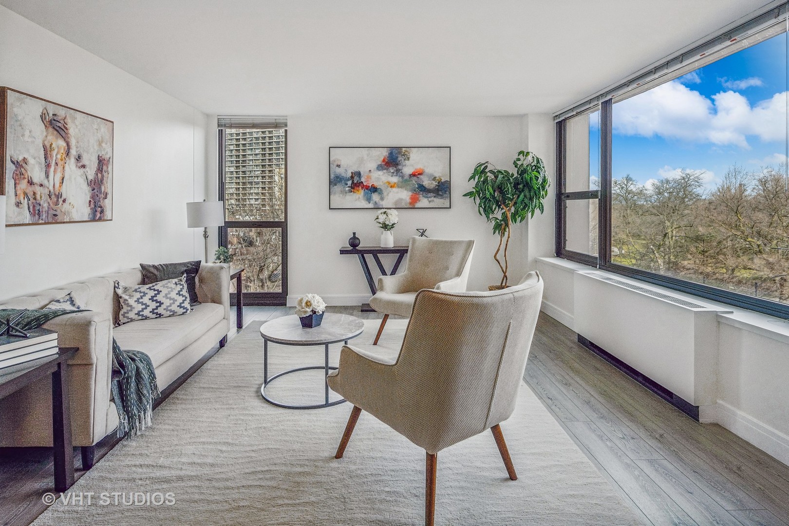 1850 North Clark Street, Unit 503 Chicago, IL 60614 - Photo 5 of 24 a living room with furniture a rug and a large window