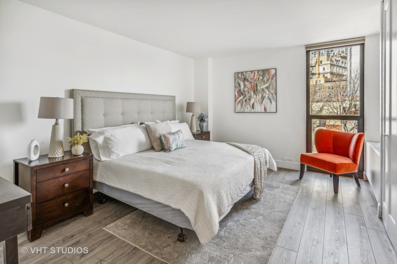 1850 North Clark Street, Unit 503 Chicago, IL 60614 - Photo 9 of 24 a bedroom with a bed and lamp