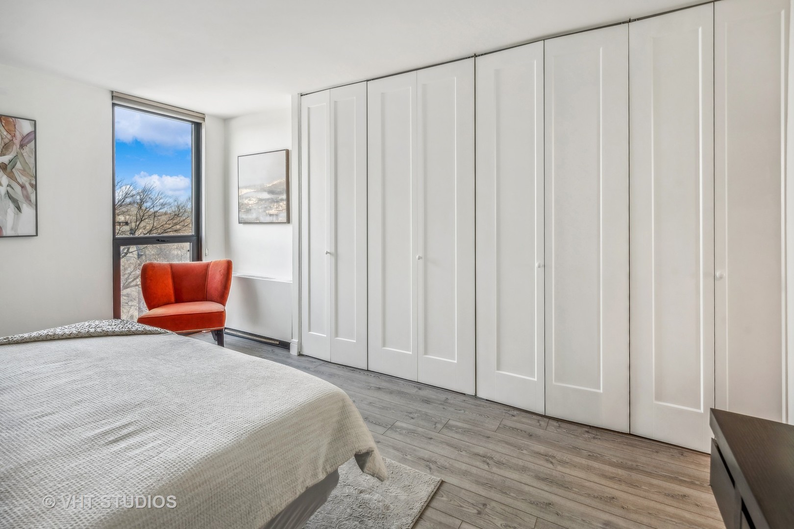1850 North Clark Street, Unit 503 Chicago, IL 60614 - Photo 10 of 24 a bedroom with a bed and chair