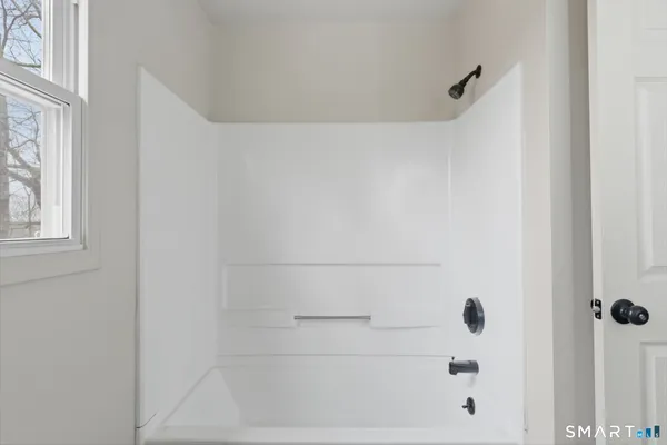 a bathroom with a sink vanity and a mirror