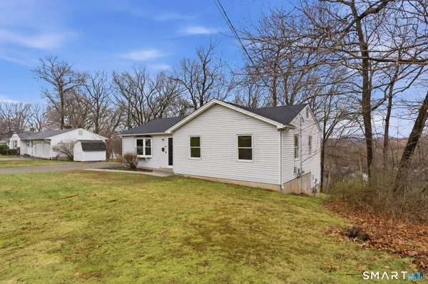 a view of a house with a yard