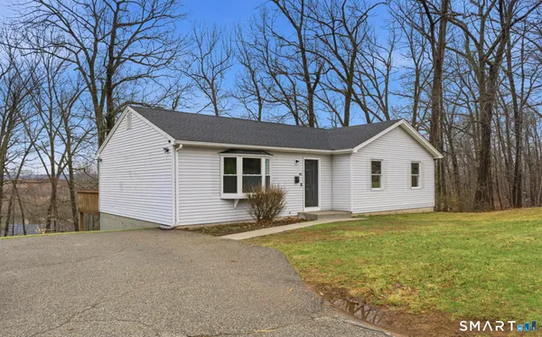 a view of a house with a yard
