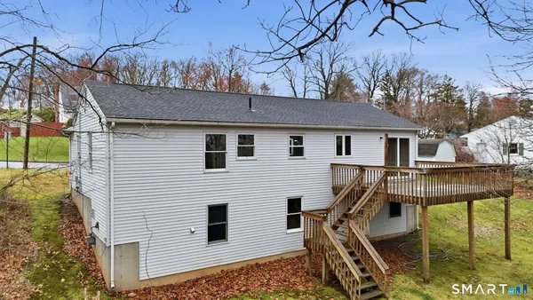 a view of a house with a backyard
