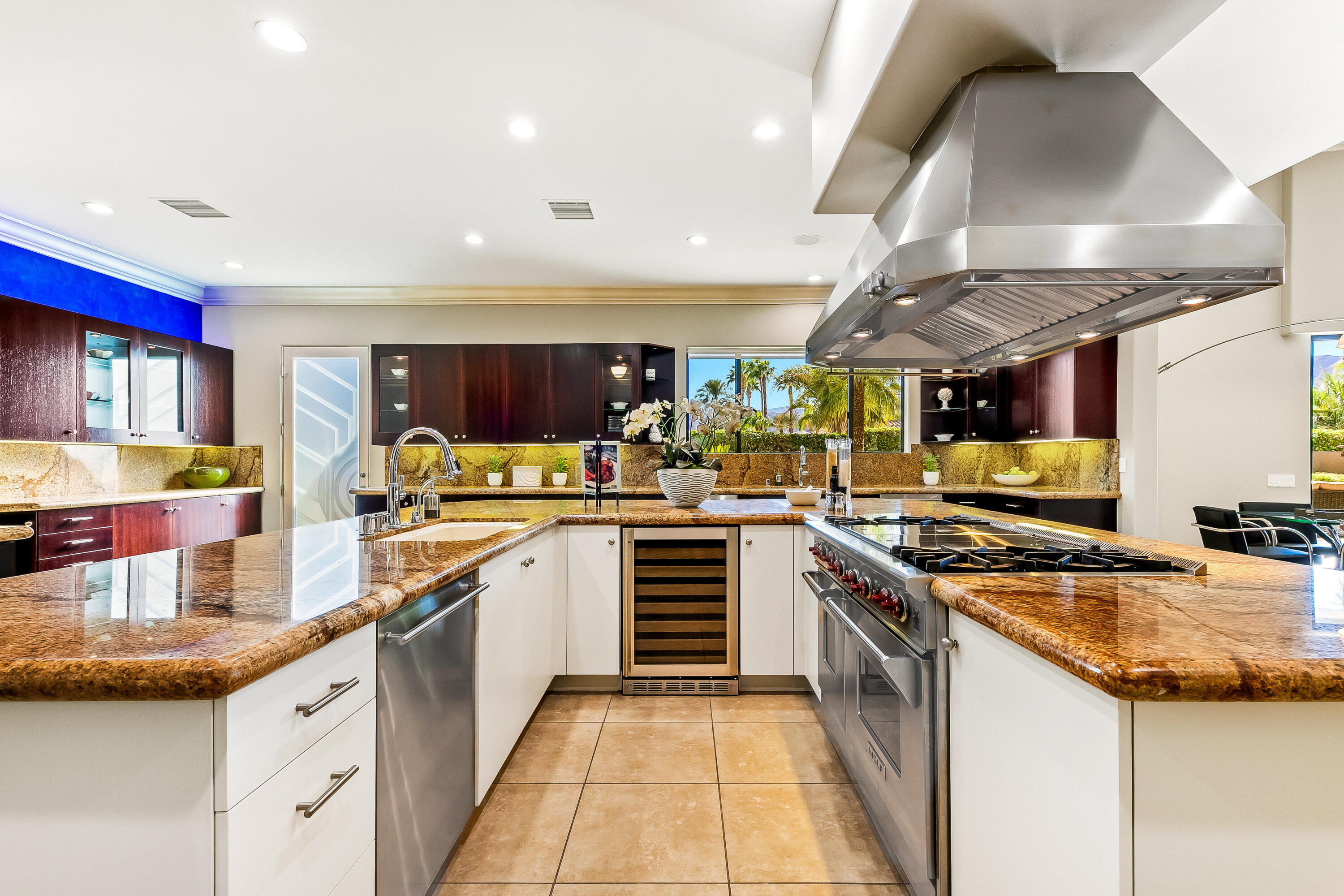 15 Sun Ridge Circle Rancho Mirage, CA 92270 - Photo 12 of 53 a kitchen with stainless steel appliances granite countertop a stove and a sink