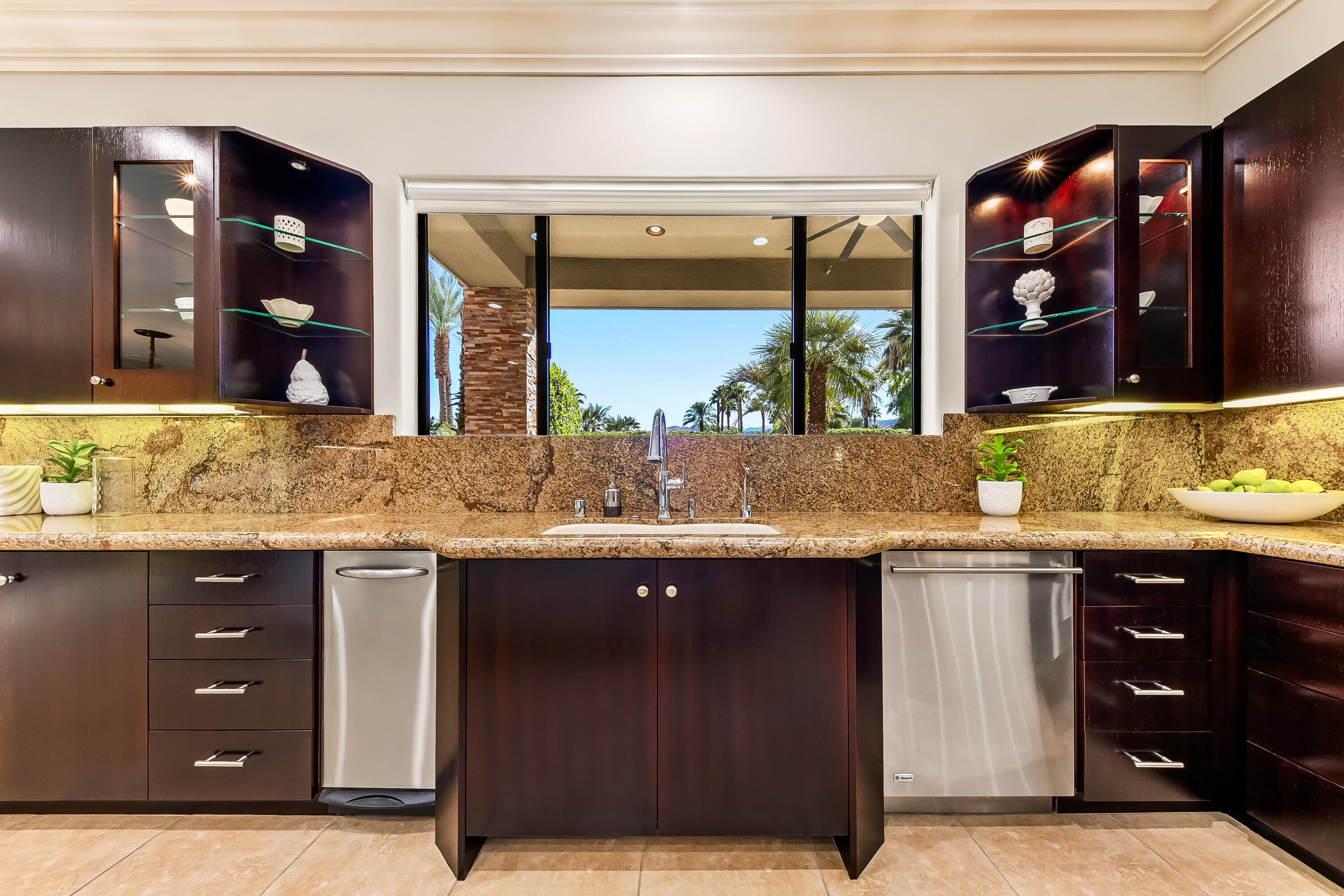 15 Sun Ridge Circle Rancho Mirage, CA 92270 - Photo 16 of 53 a bathroom with a granite countertop sink and a large mirror