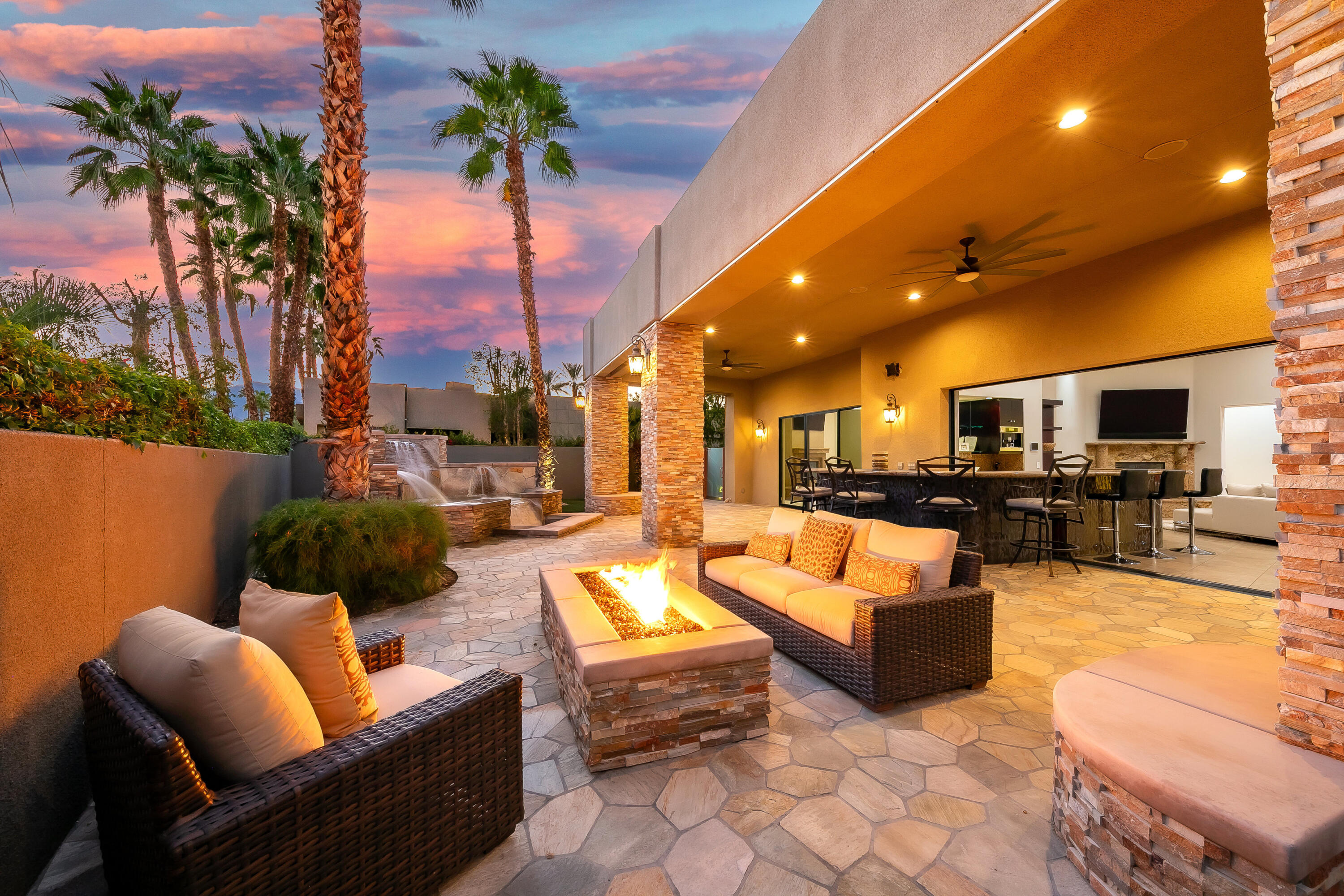 15 Sun Ridge Circle Rancho Mirage, CA 92270 - Photo 2 of 53 a outdoor living space with patio furniture and a fireplace