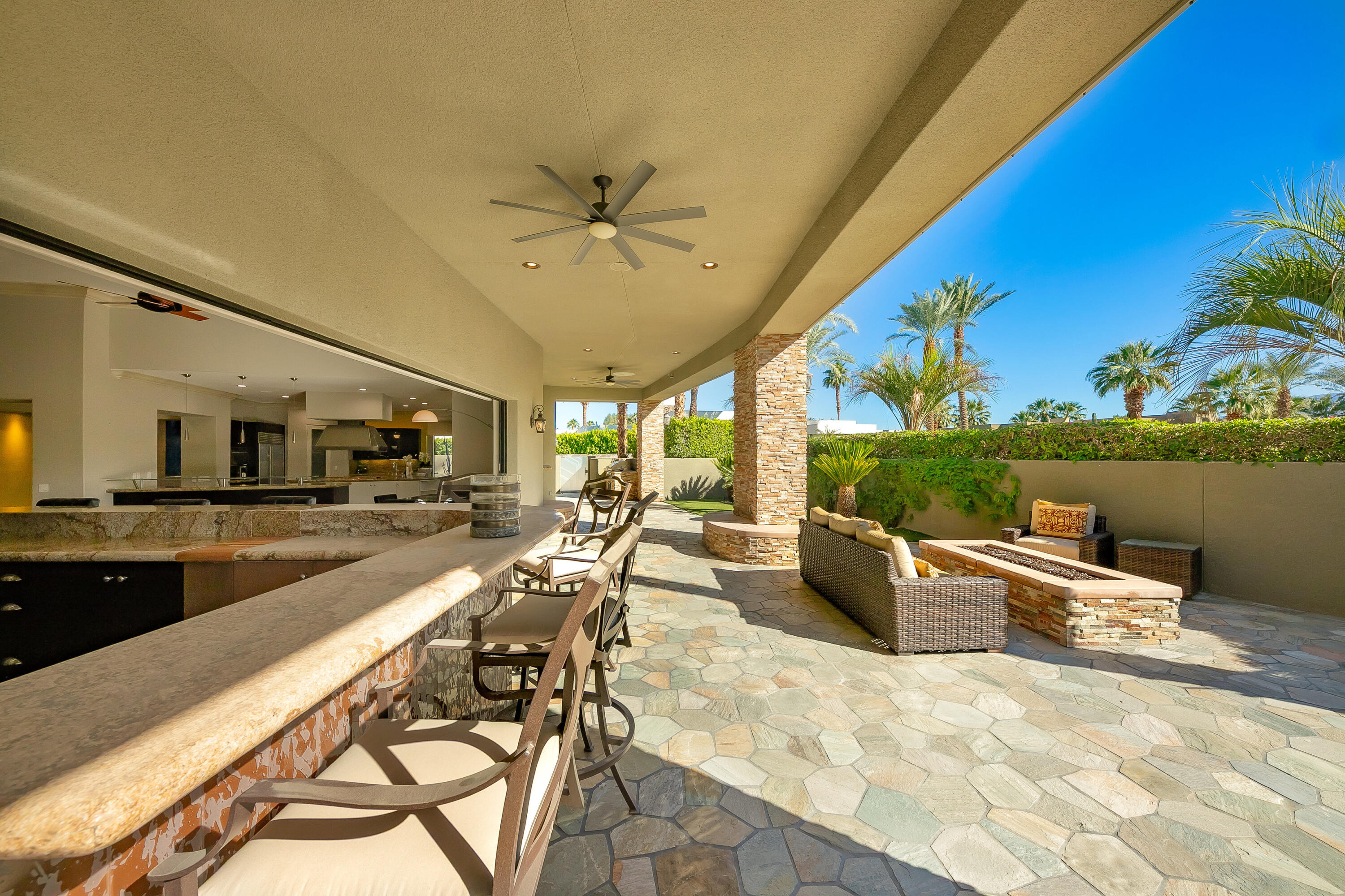 15 Sun Ridge Circle Rancho Mirage, CA 92270 - Photo 23 of 53 a view of a swimming pool with a patio