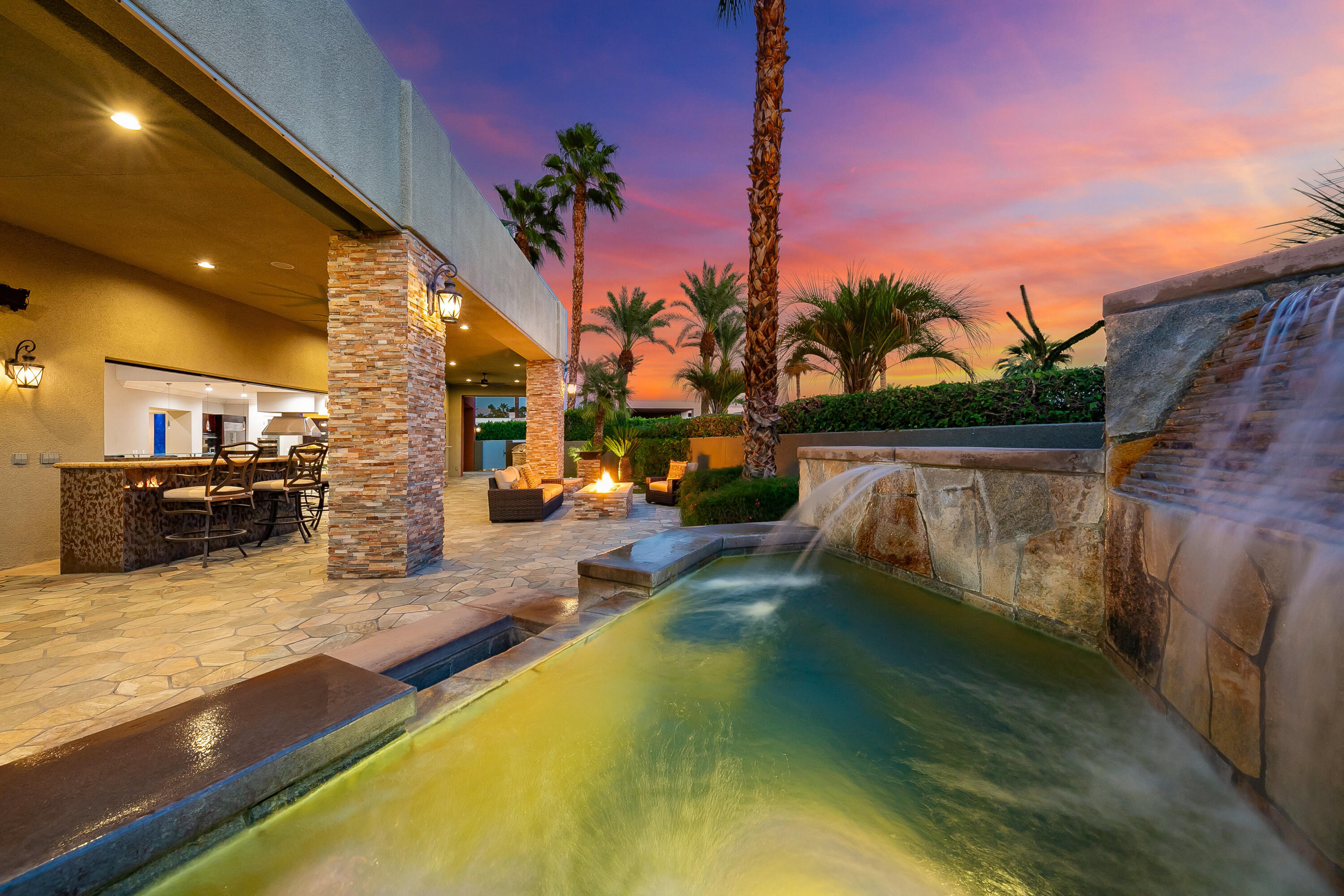 15 Sun Ridge Circle Rancho Mirage, CA 92270 - Photo 26 of 53 a view of a swimming pool with a patio