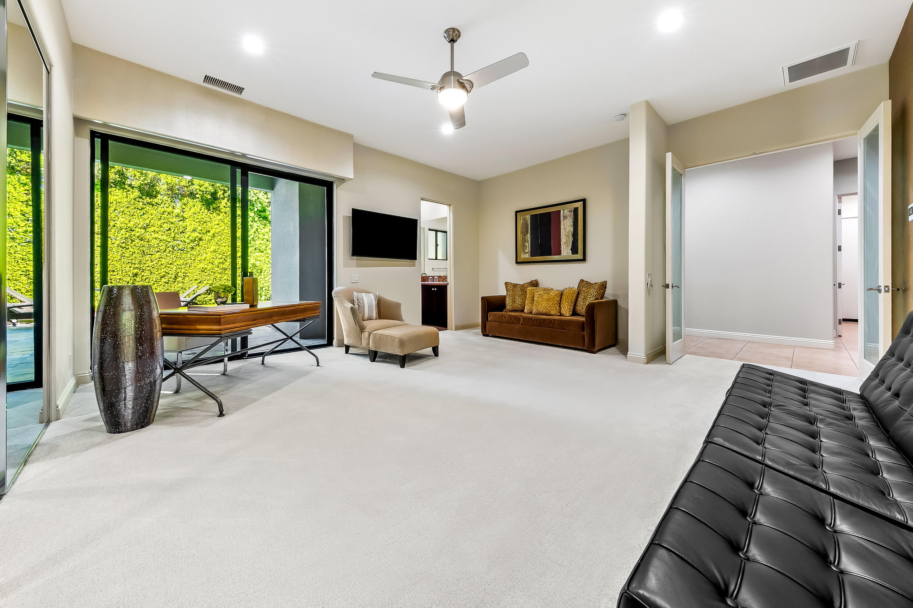 15 Sun Ridge Circle Rancho Mirage, CA 92270 - Photo 37 of 53 a bedroom with furniture and a large window