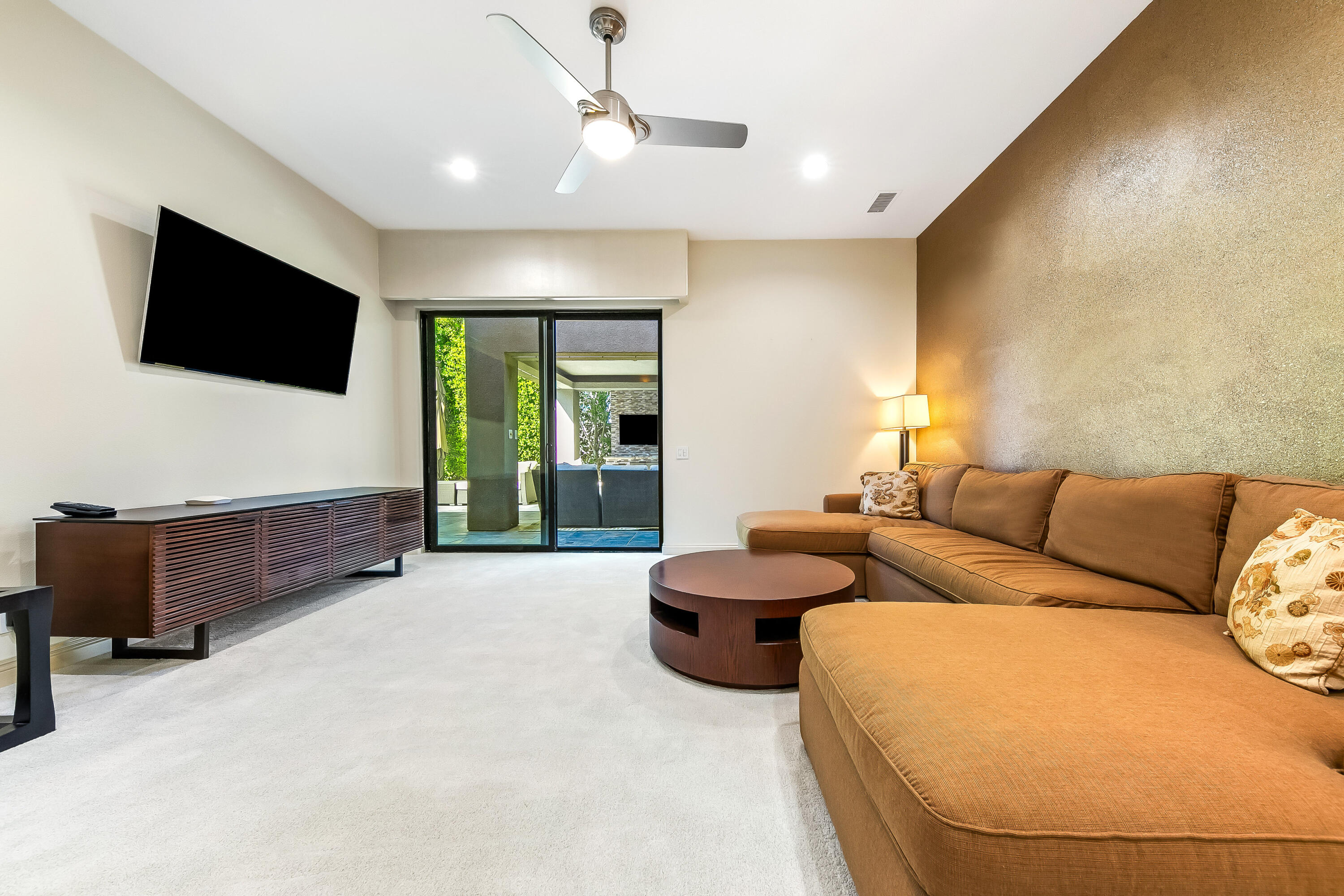 15 Sun Ridge Circle Rancho Mirage, CA 92270 - Photo 38 of 53 a living room with furniture and a flat screen tv