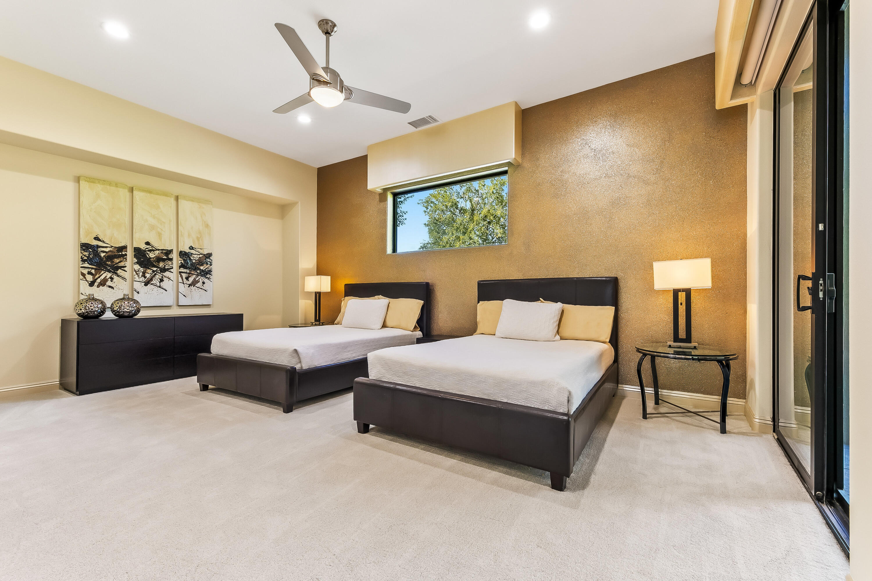 15 Sun Ridge Circle Rancho Mirage, CA 92270 - Photo 40 of 53 a spacious bedroom with a bed and a chandelier