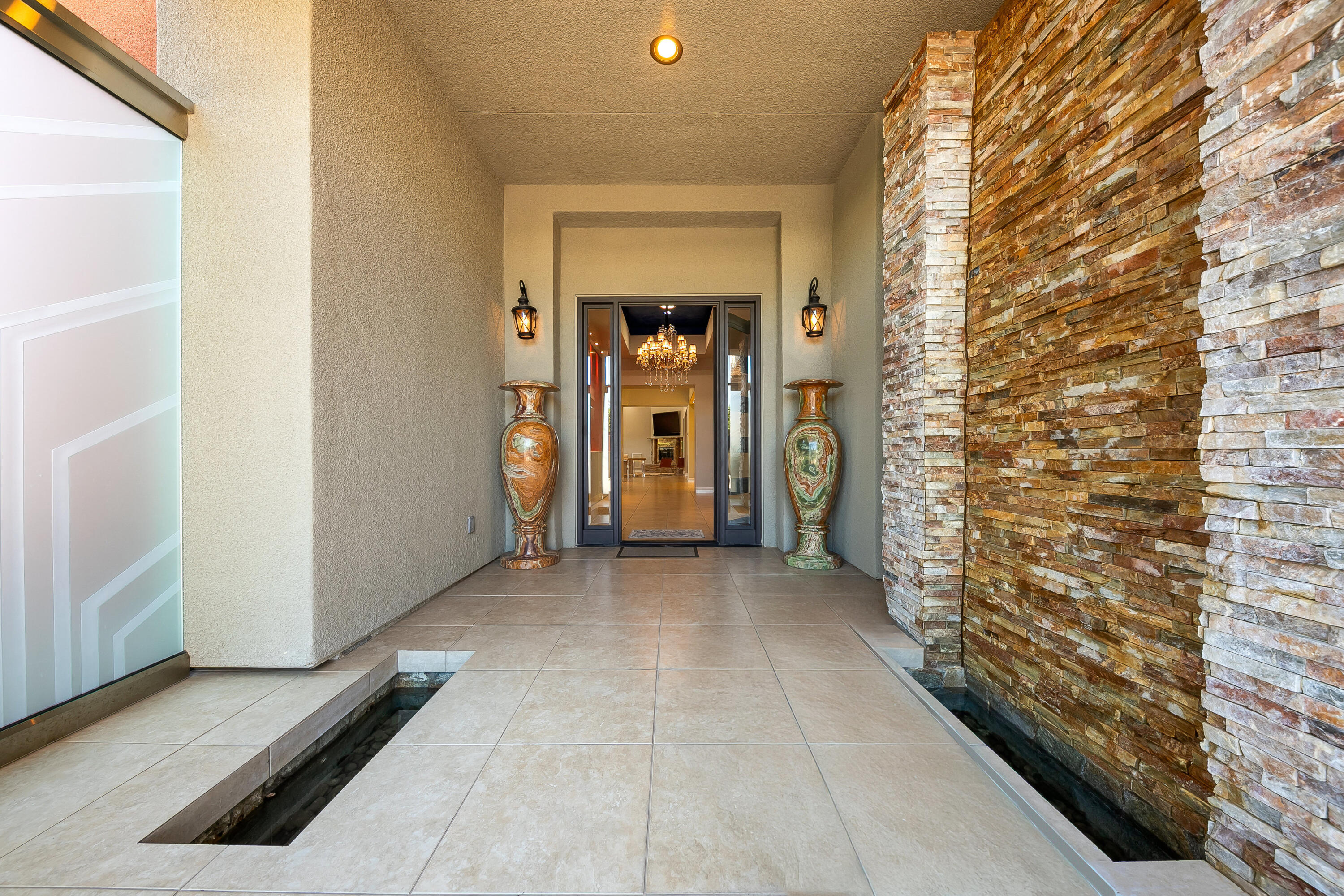 15 Sun Ridge Circle Rancho Mirage, CA 92270 - Photo 7 of 53 a view of a hallway with wooden shelves