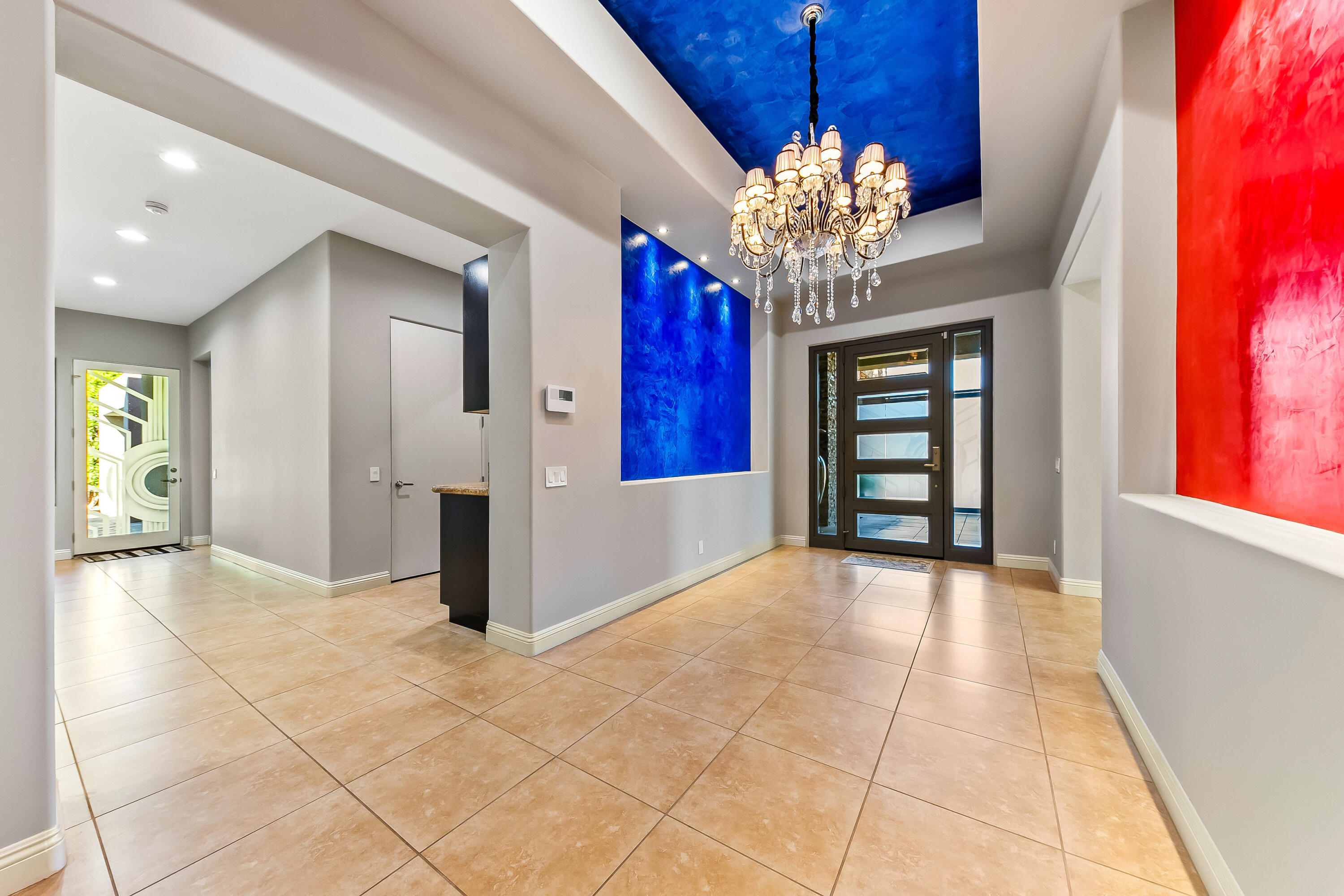 15 Sun Ridge Circle Rancho Mirage, CA 92270 - Photo 8 of 53 a view of a hallway with a chandelier and chandelier