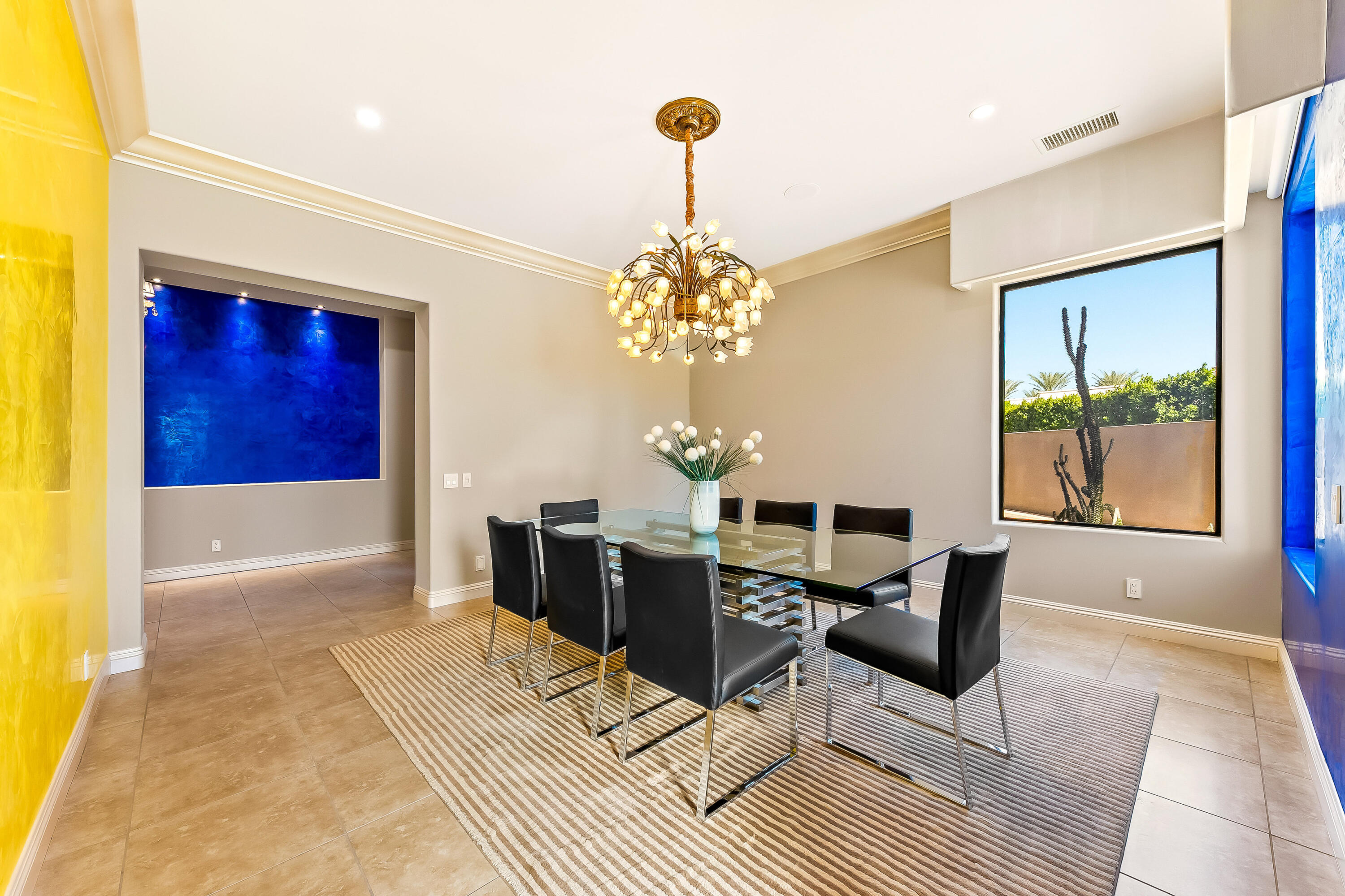15 Sun Ridge Circle Rancho Mirage, CA 92270 - Photo 10 of 53 a dining room with chandelier and wooden floor