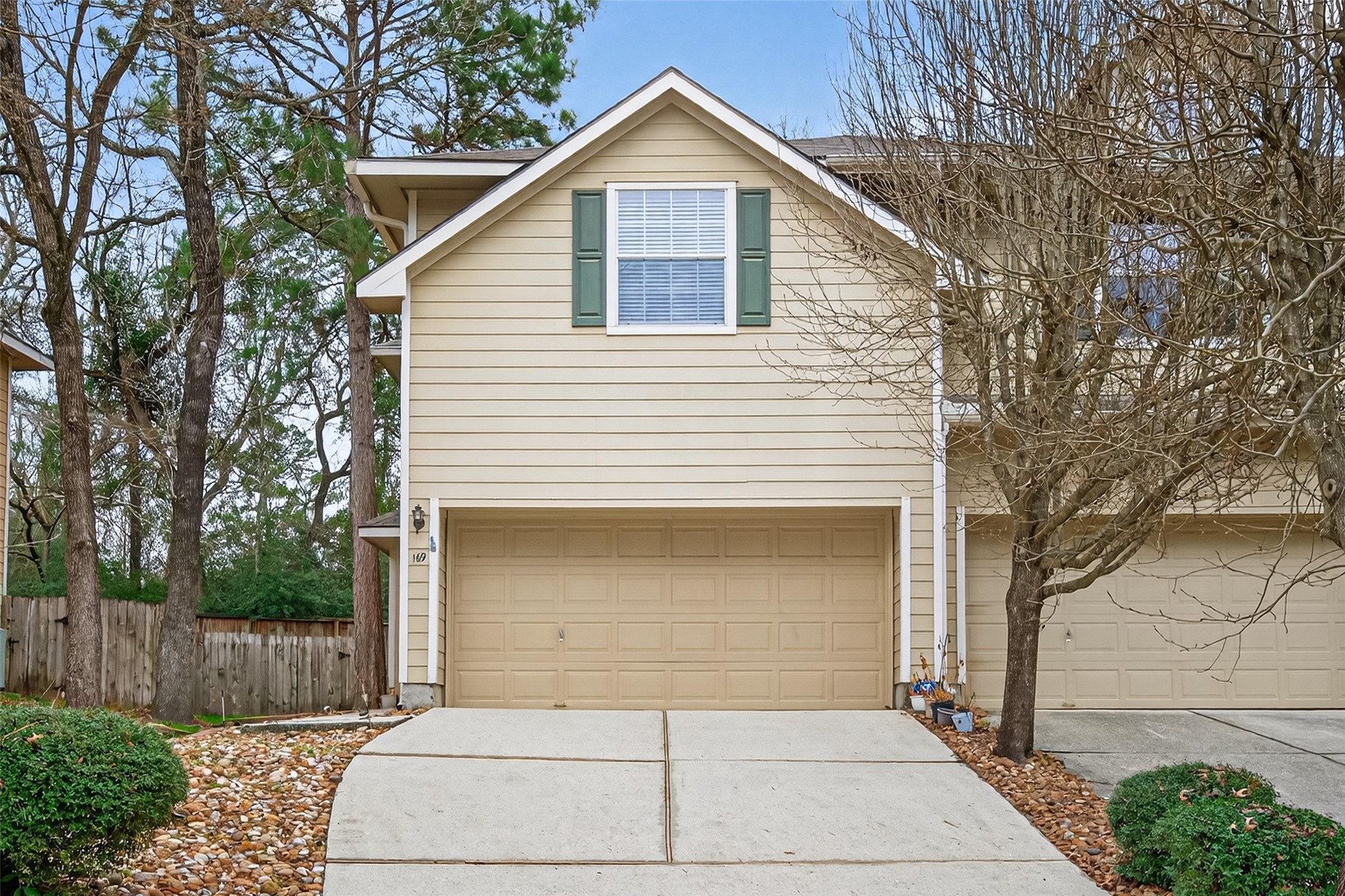 a front view of a house with garage