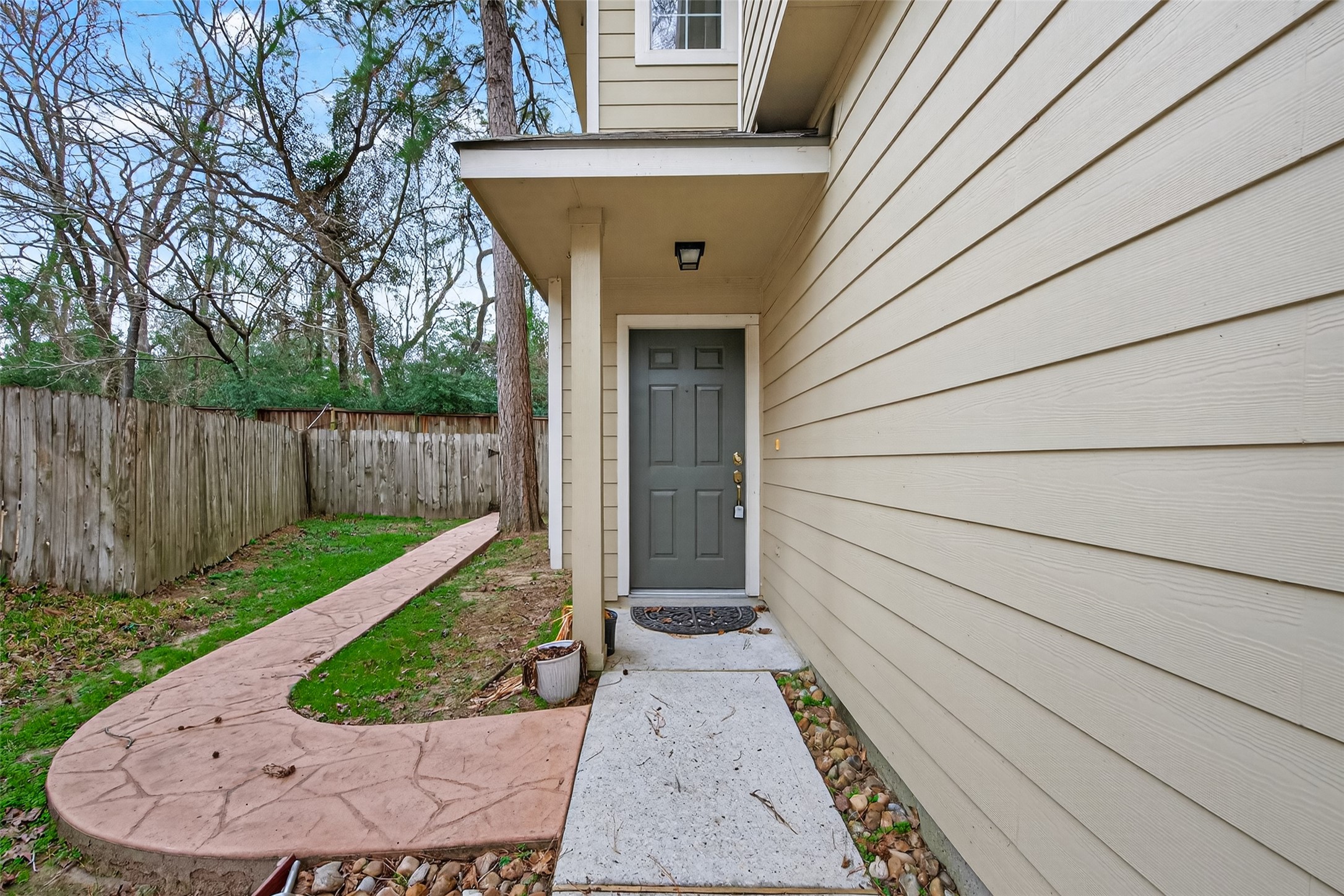 169 Musewood Court Spring, TX 77382 - Photo 3 of 44 a view of a pathway of a house with a backyard