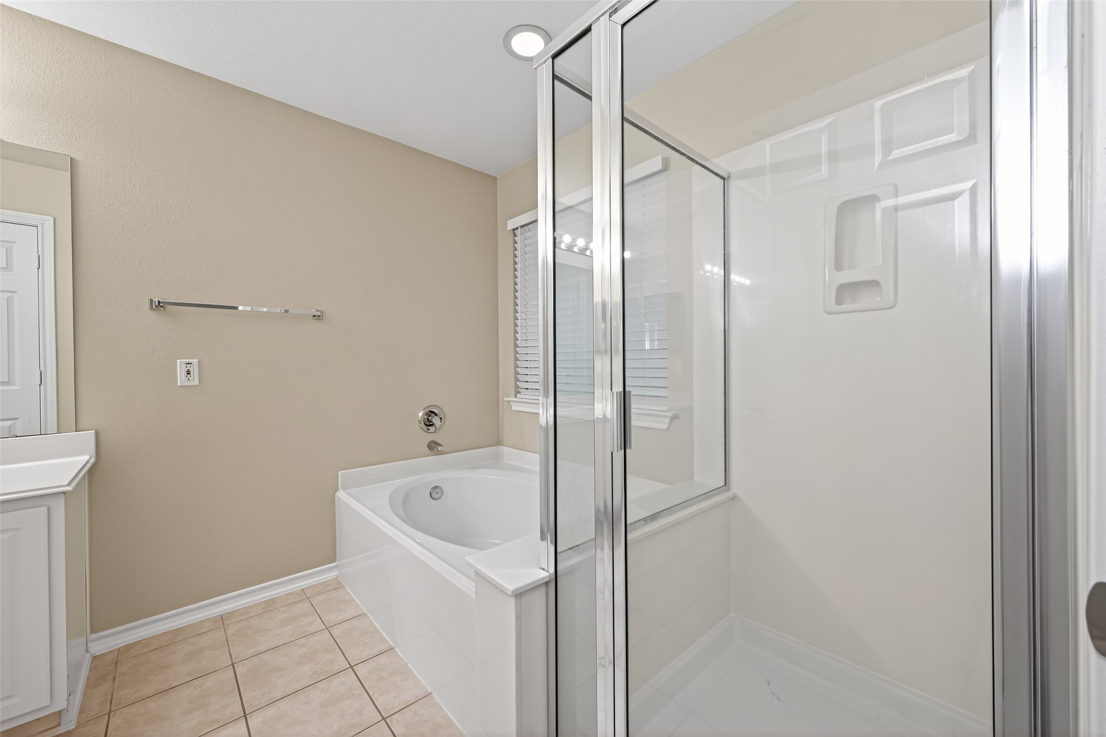 169 Musewood Court Spring, TX 77382 - Photo 37 of 44 a bathroom with a bathtub and a shower