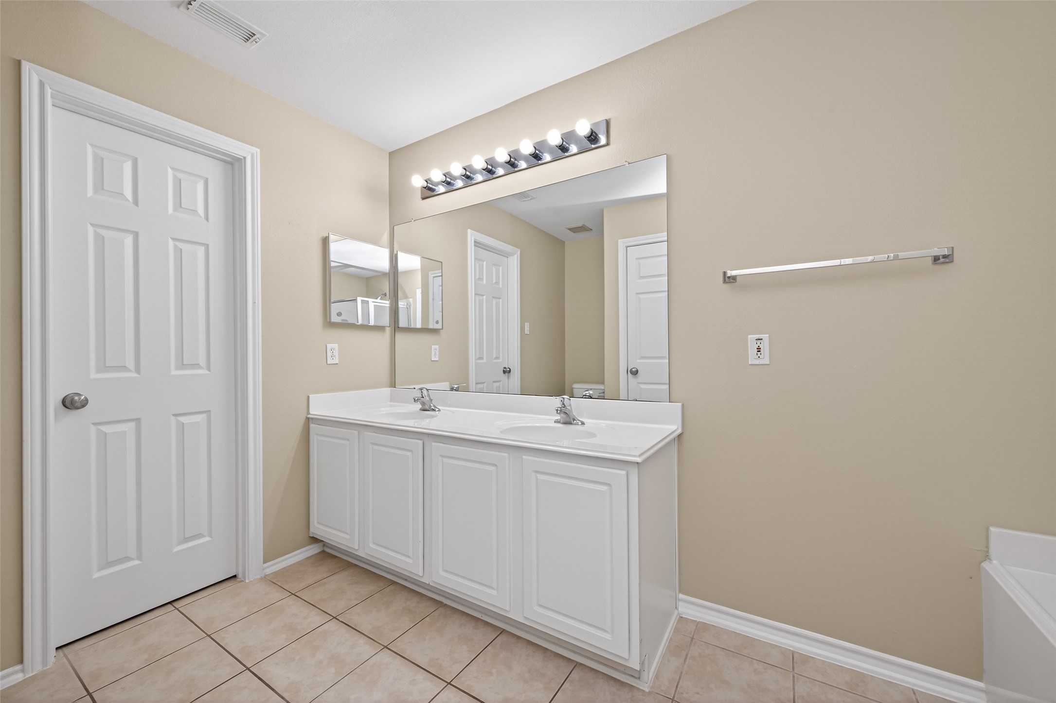 169 Musewood Court Spring, TX 77382 - Photo 38 of 44 a spacious bathroom with a double vanity sink and a mirror