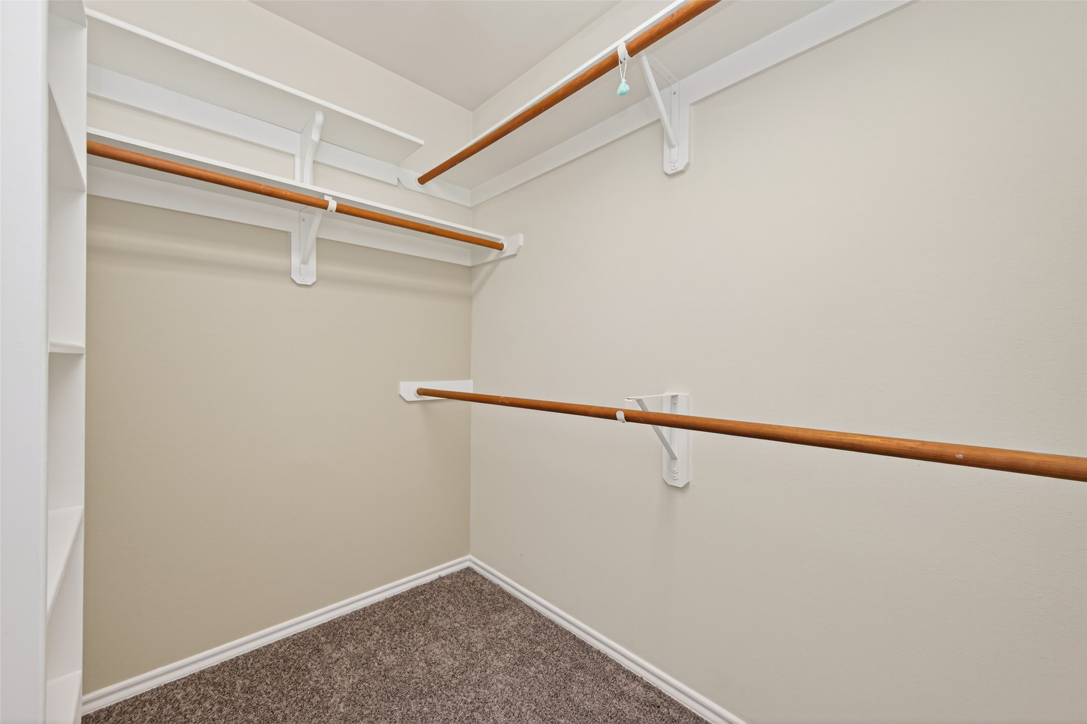 169 Musewood Court Spring, TX 77382 - Photo 40 of 44 a view of a room with racks on the wall