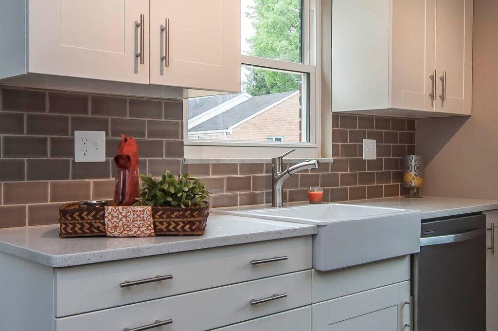 1327 Freeport Road Pittsburgh, PA 15238 - Photo 13 of 25 Note the stylish porcelain farmhouse sink, pull out faucet and timelessly elegant subway tile backsplash. Not visible is the powerful 1 1/4 HP garbage disposal.