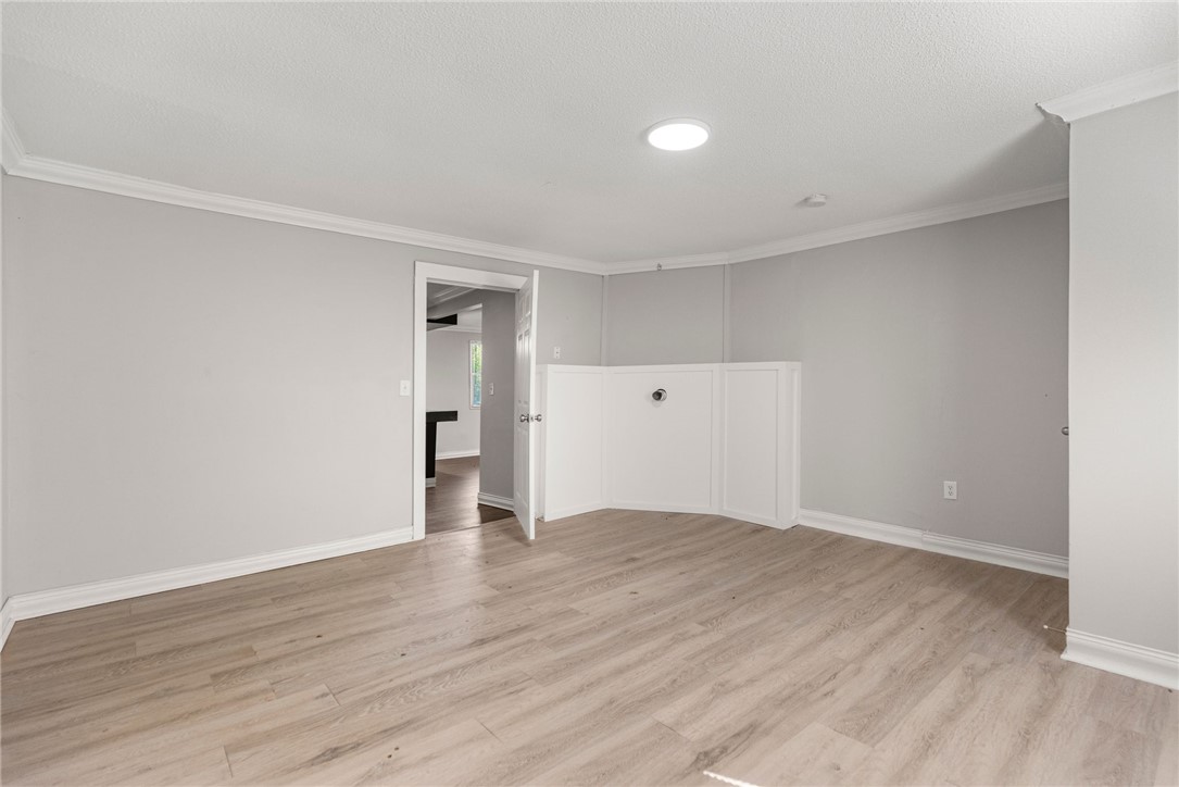 109 Farmer Street Anderson, SC 29621 - Photo 21 of 31 Clean, light-toned flooring complements the neutral walls, creating an inviting atmosphere for any design.