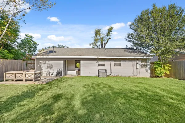 a front view of house with yard and seating area