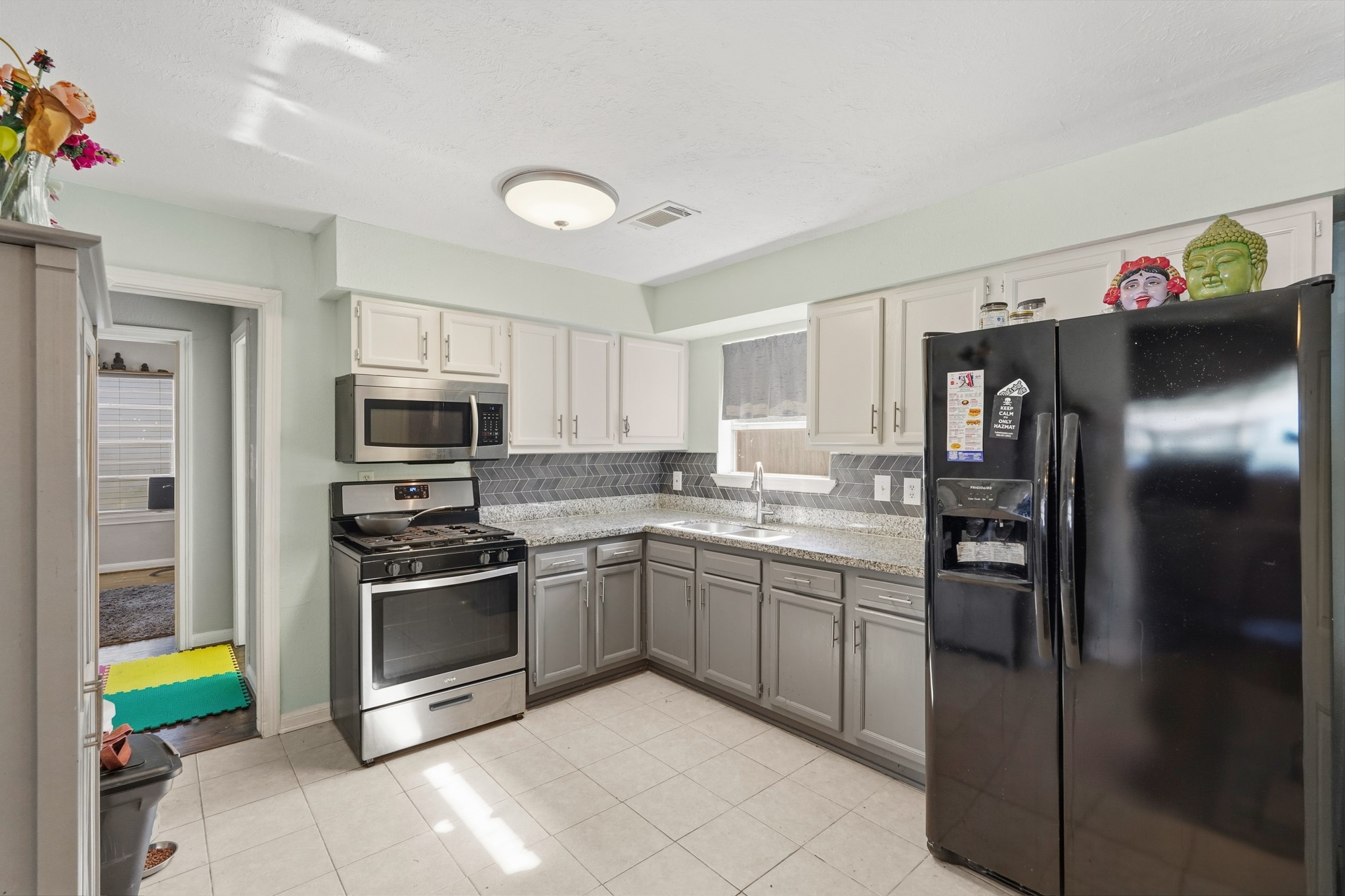 5110 Perry Street Houston, TX 77021 - Photo 6 of 15 a kitchen with stainless steel appliances granite countertop a refrigerator and a stove top oven