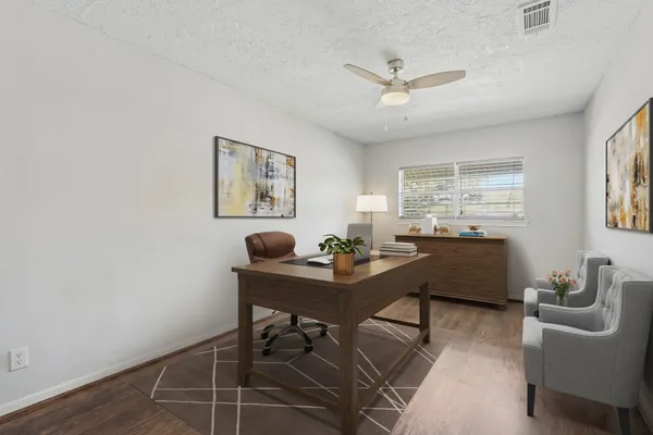 a workspace with furniture and window