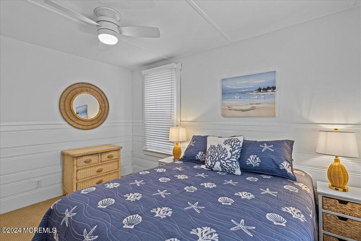 51 3rd Avenue, Unit B WINTER RENTAL Lavallette, NJ 08735 - Photo 17 of 29 a bedroom with a bed and a lamp on dresser