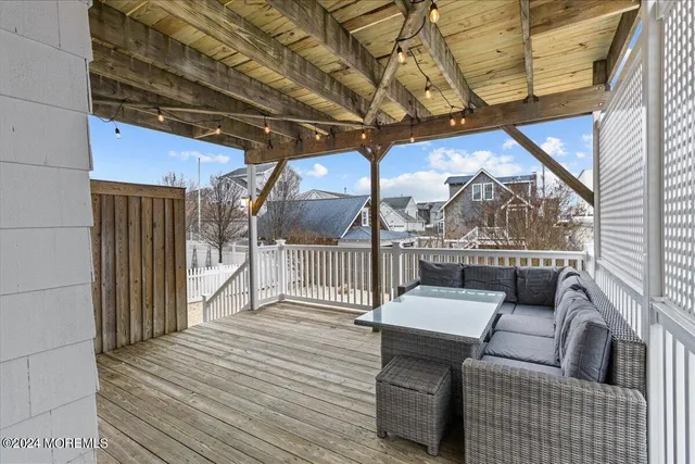 a view of balcony with wooden floor