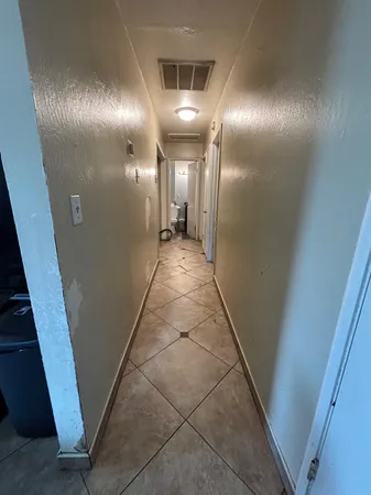 a room with gym equipment and a mirror