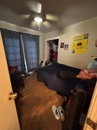 a living room with furniture gym equipment and a window