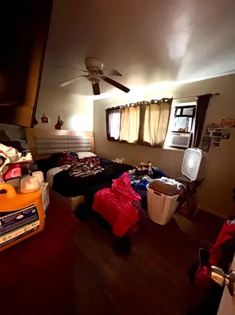 a white toilet sitting next to a shower curtain