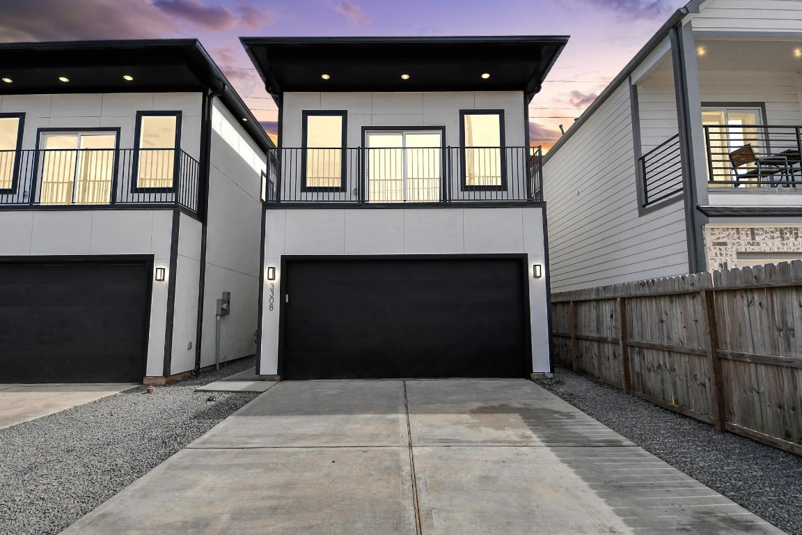 a front view of a house with a door in front of it